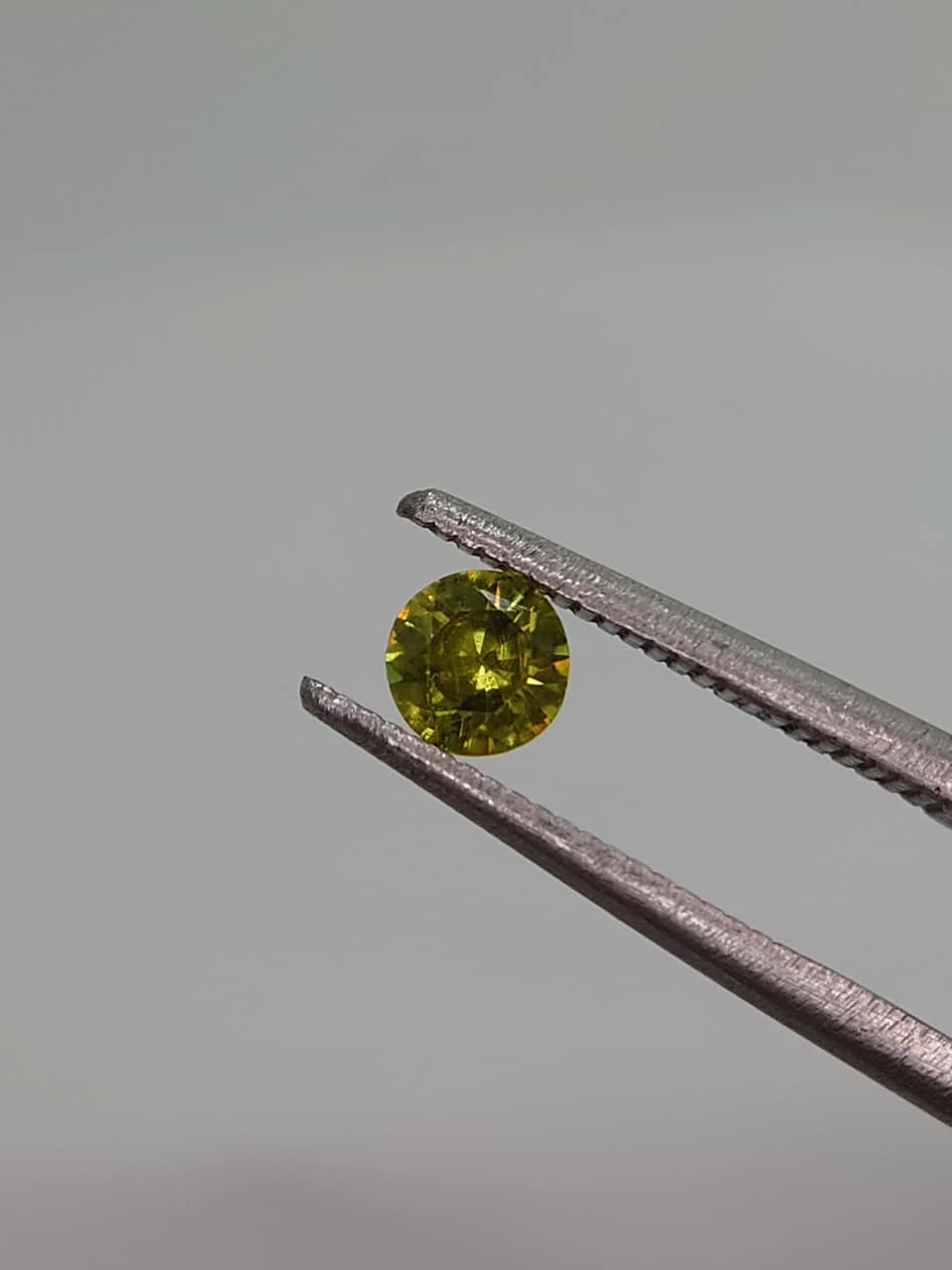 0.3ct Round Faceted Demantoid Garnet from Pakistan — view 3